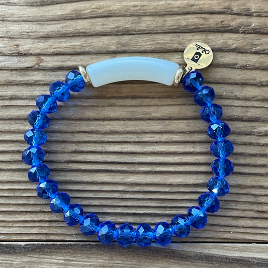 Bracelet tube acrylique Ivoire et perles facettées aplaties bleu roi